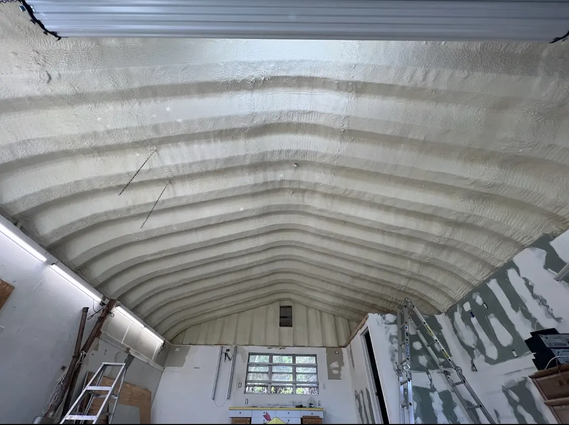 Spray polyurethane foam applied to the underside of a metal roof deck in Fitchburg